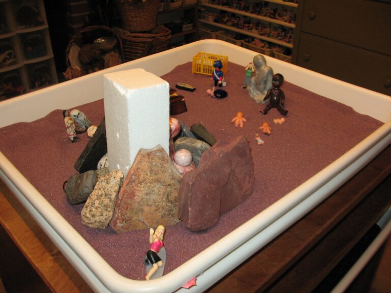 A sandbox with small toys Description automatically generated with medium confidence